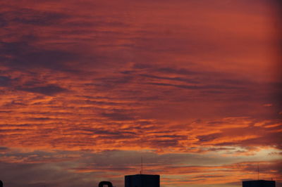 Low angle view of dramatic sky during sunset