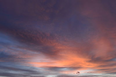 Low angle view of dramatic sky during sunset