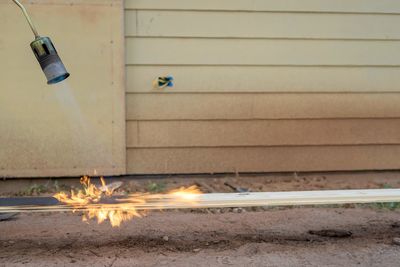 Burning wood with a blow torch using shou sugi ban method 