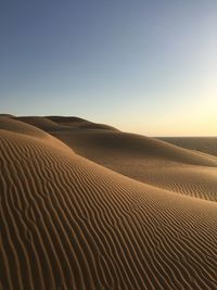 Scenic view of desert against clear sky