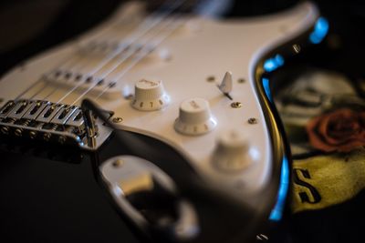 Close-up of guitar on table