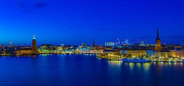 Illuminated buildings at waterfront