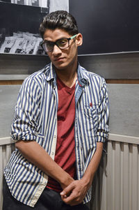 Portrait of young man standing outdoors