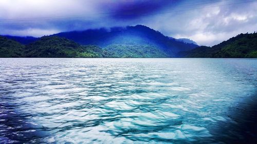 Scenic view of sea against dramatic sky