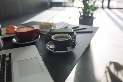 High angle view of coffee cup on table