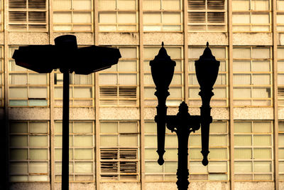 Silhouette of poles at santa ifigenia viaduct and anhangabau valley with windows background,