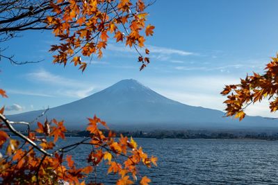 Scenic view of snowcapped mountains against sky during autumn