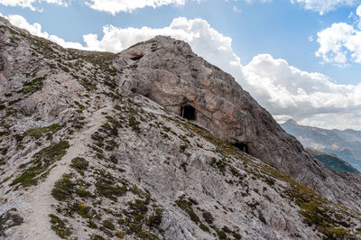 Low angle view of rock formation against sky