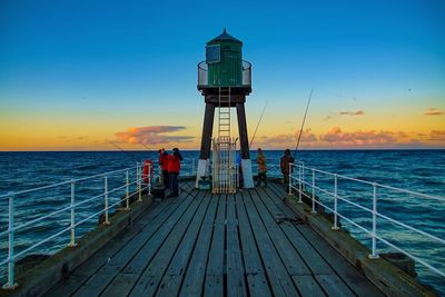 Scenic view of sea against clear sky during sunset