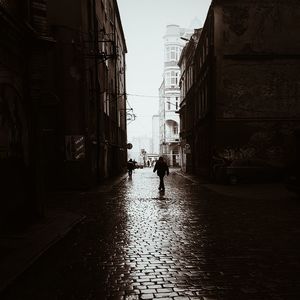 Full length of people walking in building