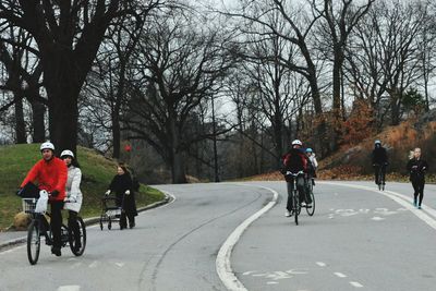 People riding bicycle on road