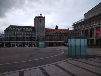 View of buildings against cloudy sky