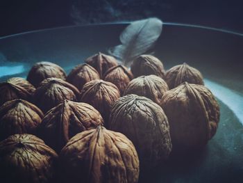 Close-up of walnuts in container