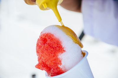 Close-up of hand holding ice cream