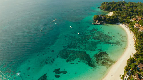 Tropical lagoon with turquoise water and white sand beach boracay, philippines. 