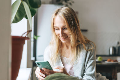 Young woman using mobile phone