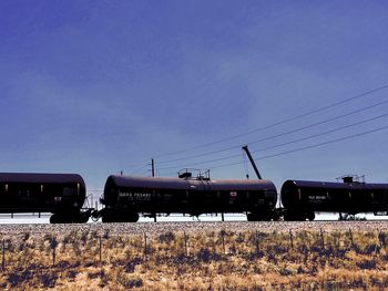 Train on railroad tracks against sky