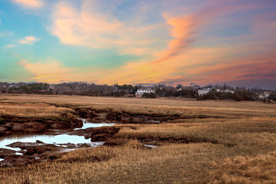 Sunset sky over the marsh and sesuit creek in east dennis in winter