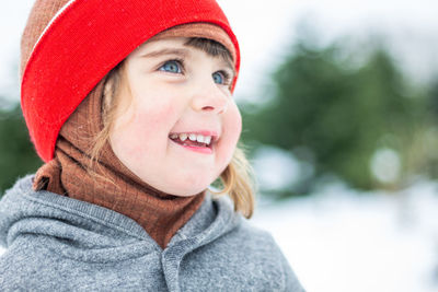 3 year old child outdoors in nature in winter