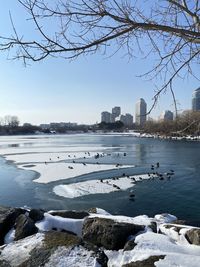 Scenic view of frozen lake against sky during winter