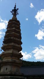 Low angle view of statue against sky