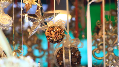 Close-up of fruits hanging at market stall