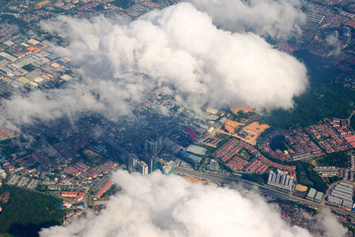 Aerial view of the modern city in malaysia with houses, streets. view from an airplane 