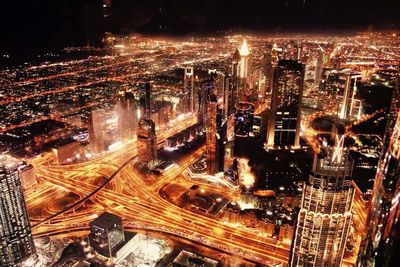 High angle view of illuminated cityscape at night