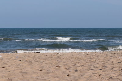 Scenic view of beach against clear sky