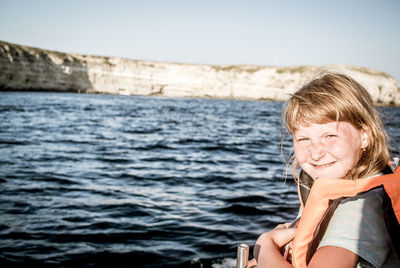 Portrait of a smiling woman in sea