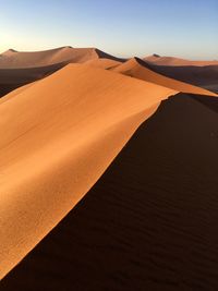 Scenic view of desert against clear sky