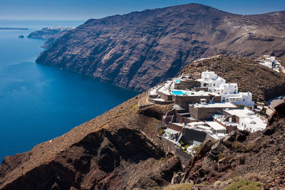 High angle view of buildings by sea against sky