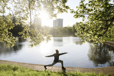 Man doing stretching exercise in park