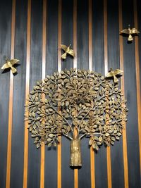 Low angle view of lighting equipment hanging on wall