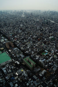 High angle view of city buildings against sky