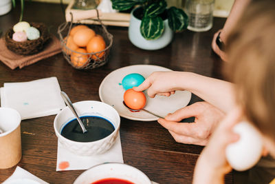 Midsection of woman having breakfast