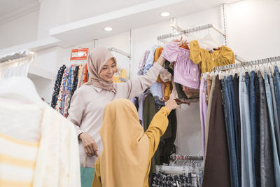 Mother and daughter shopping in mall