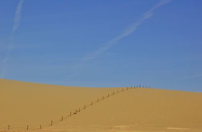 Scenic view of desert against sky