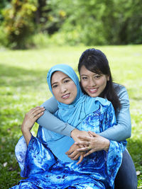 Portrait of smiling woman with mother