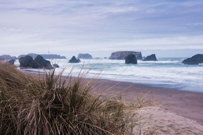 Scenic view of beach against sky