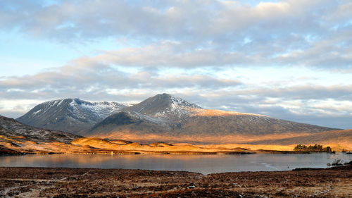 Scenic view of lake against sky during sunset