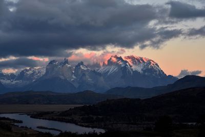 Scenic view of mountains against dramatic sky