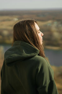 Rear view of woman looking away