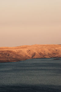 Scenic view of desert against clear sky