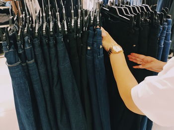 Midsection of person in bikini at store