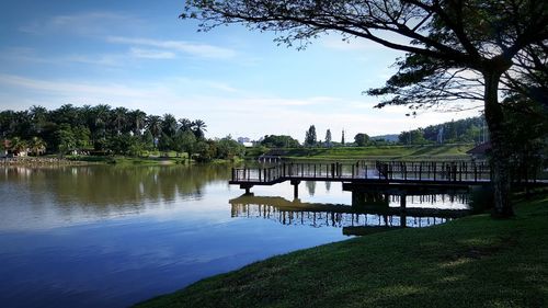 Scenic view of lake against cloudy sky