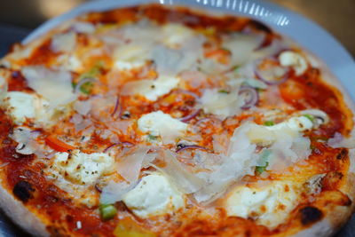 Close-up of pizza served on table