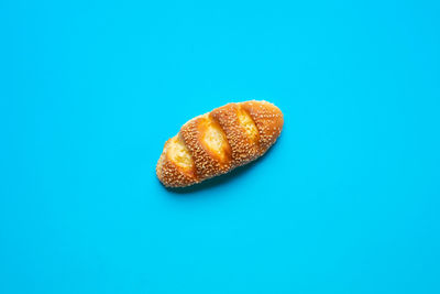 High angle view of bread on blue background