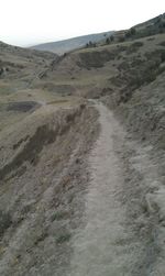 Dirt road passing through landscape