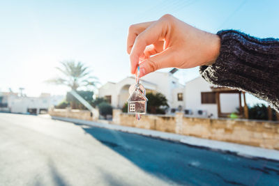 Cropped hand of woman holding water